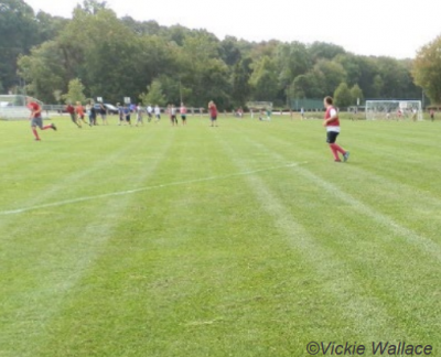 Youth playing soccer on field. Photo by Vickie Wallace