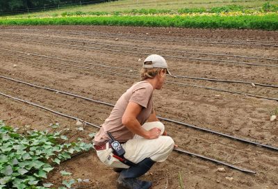 Farmer doing a field demonstration of drip irrigation