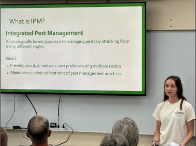 Extension intern Holly McNamara discusses IPM principles with participants at the 4th annual IPM Seminar for Home Gardeners event. 
